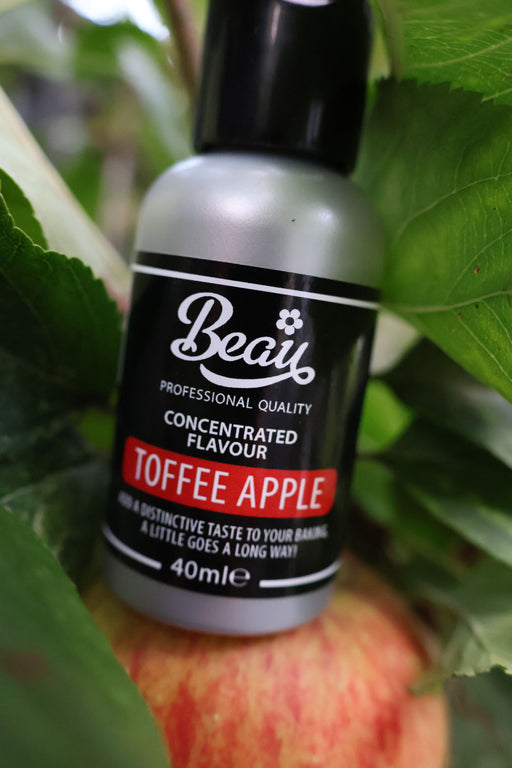Bottle of Beau Products Concentrated Flavour Toffee Apple on an apple with green leaves in the background