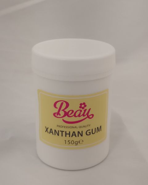 Jar of xanthan gum with 'Beau' label on a gray background