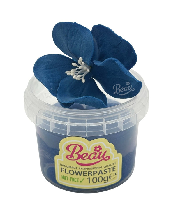 Handmade cornflower blue flower created with Beau flowerpaste