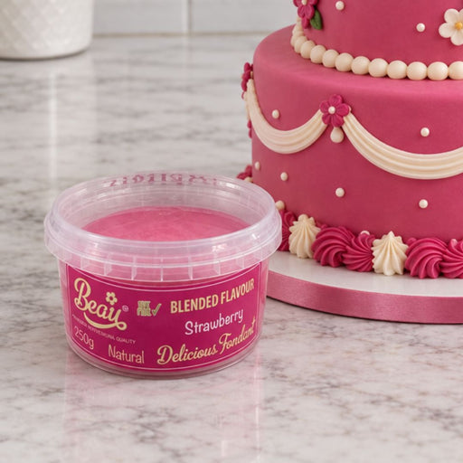 A tub of Beau's Strawberry Flavoured Fondant sitting in front of a cake.