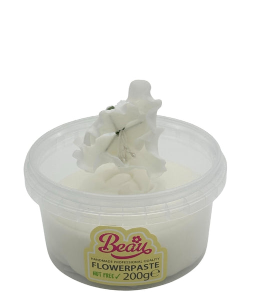 Handmade white flower created with Beau flowerpaste