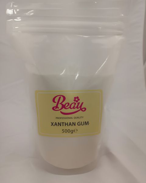 Bag of xanthan gum with a yellow label on a white background
